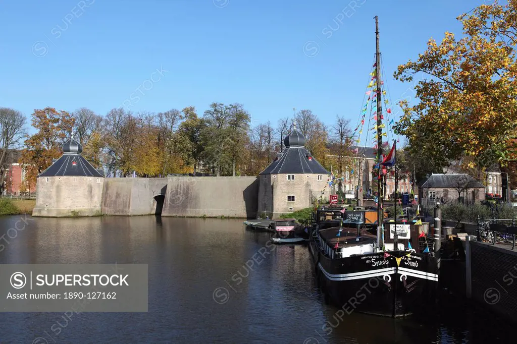 The Spinola boat is docked in front of the Spanish Gate Spanjaardsgat by the harbour of Breda, Noord_Brabant, Netherlands, Europe