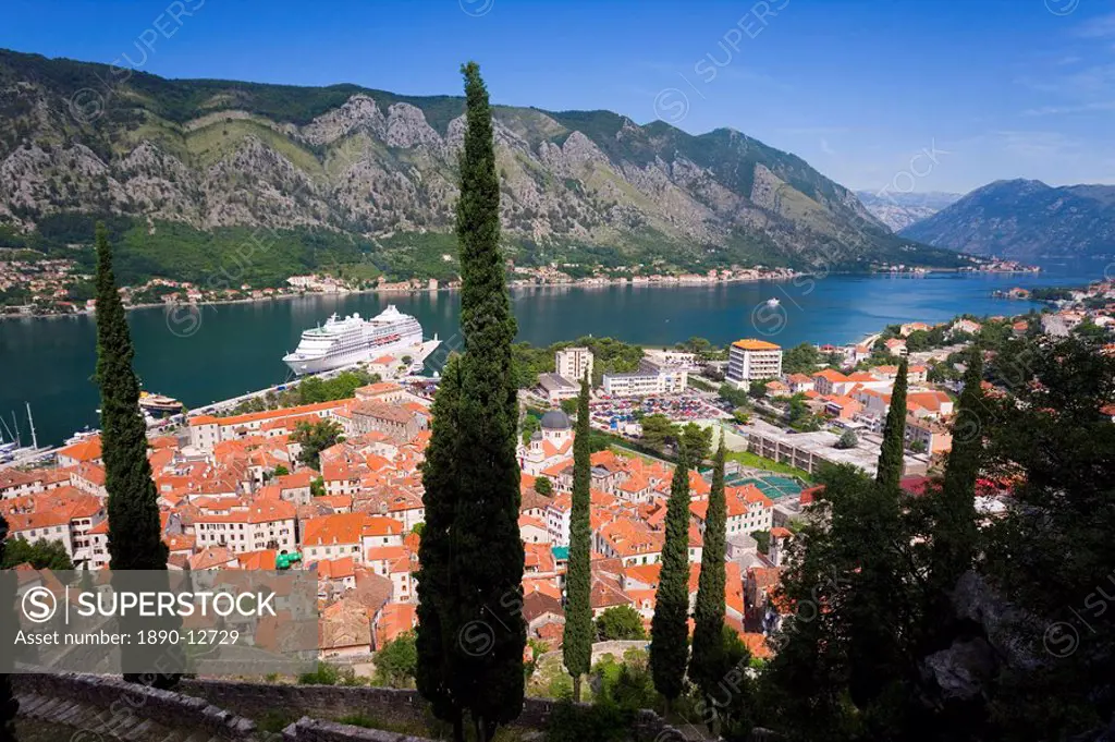 Elevated view over the Old Town, Fjord and mountains from the walls of the Kotor fortress which forms a continuous belt around the Old Town, UNESCO Wo...