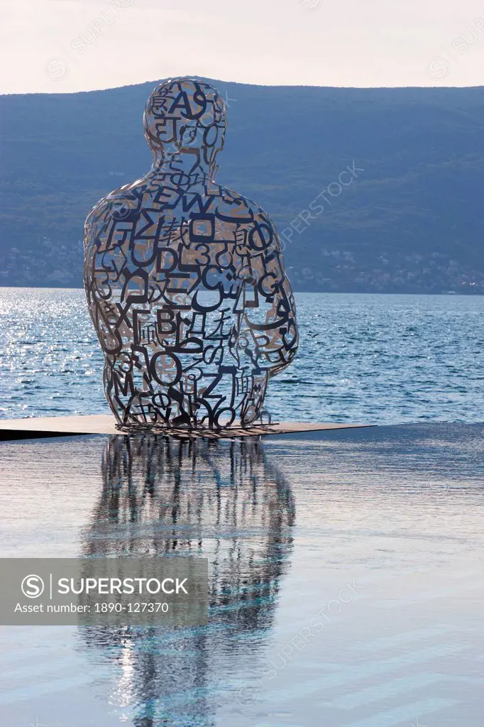 Sculpture of a man made of letters at the Lido Mar swimming pool at the newly developed Marina in Porto Montenegro, Montenegro, Europe