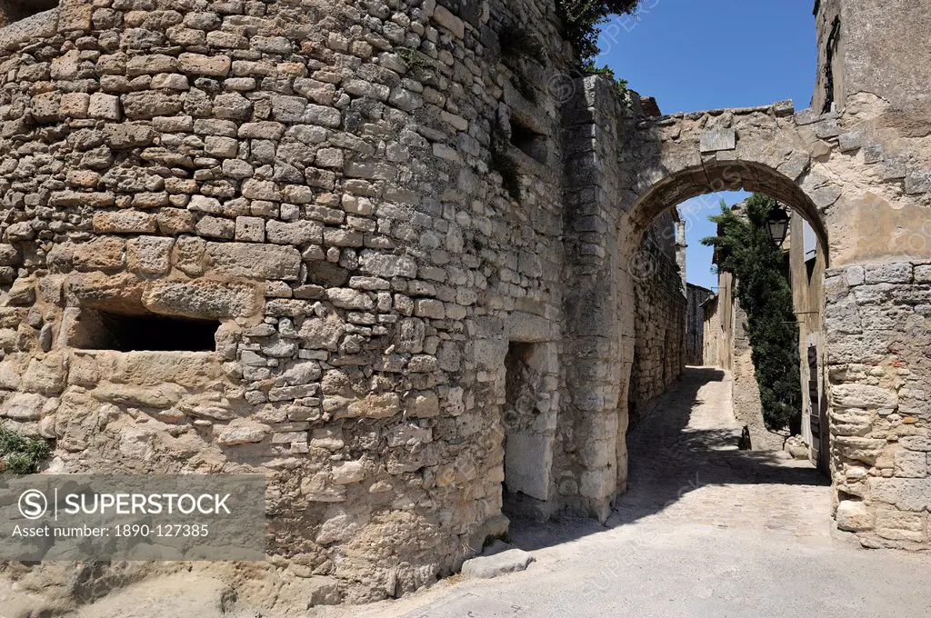 Portail des Chevres old town gate in the picturesque medieval village of Lacoste, Provence, France, Europe