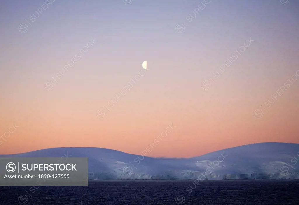 Midnight moon over the Antarctic Peninsula, Antarctica, Polar Regions