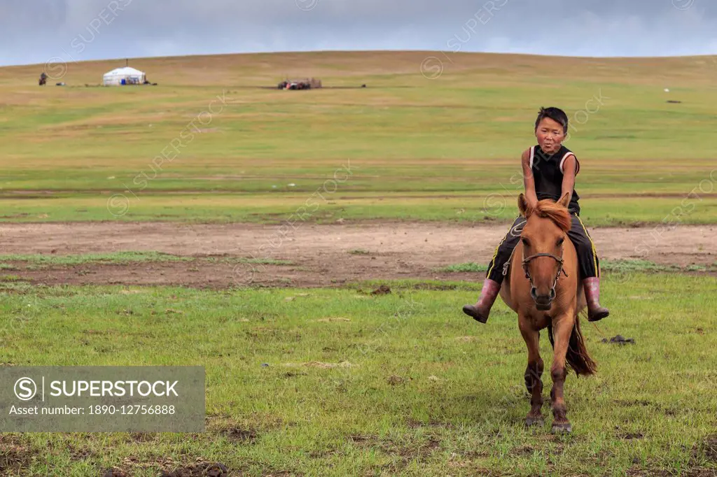 Horse and boy riding bareback with ger behind at summer nomad camp, Khujirt, Uvurkhangai (Ovorkhangai), Central Mongolia, Central Asia, Asia