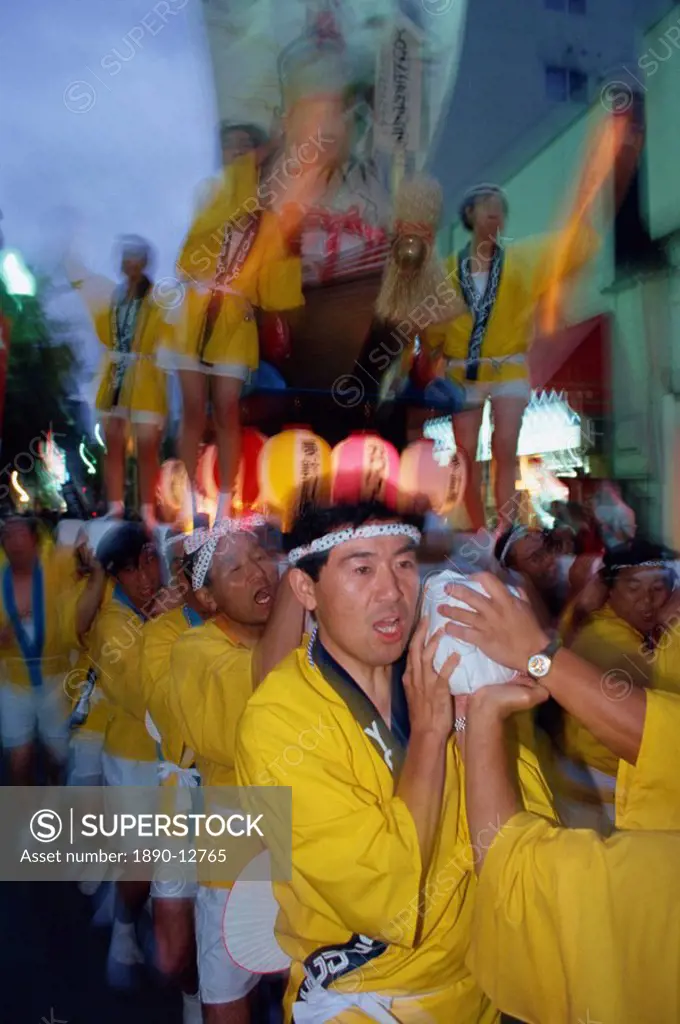A group of men carrying a shrine during Mikoshi, portable shrine festival, in Asahikawa, Japan, Asia