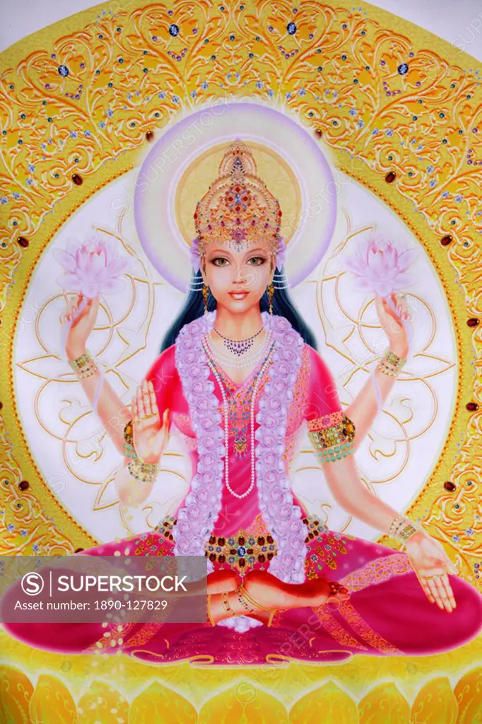 Picture of Lakshmi, goddess of wealth and consort of Lord Vishnu, sitting holding lotus flowers, Haridwar, Uttarakhand, India, Asia