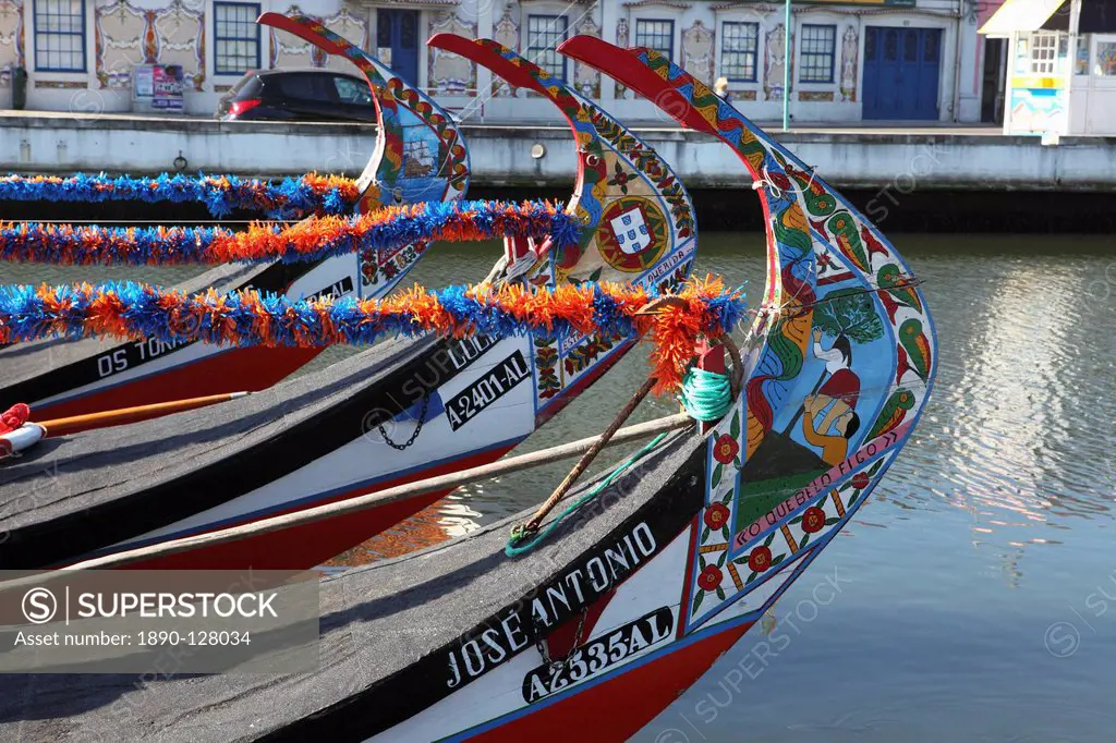 The prows of gondola_like Moliceiros, boats used to give tourists rides along the canals of Aveiro, Beira Litoral, Portugal, Europe