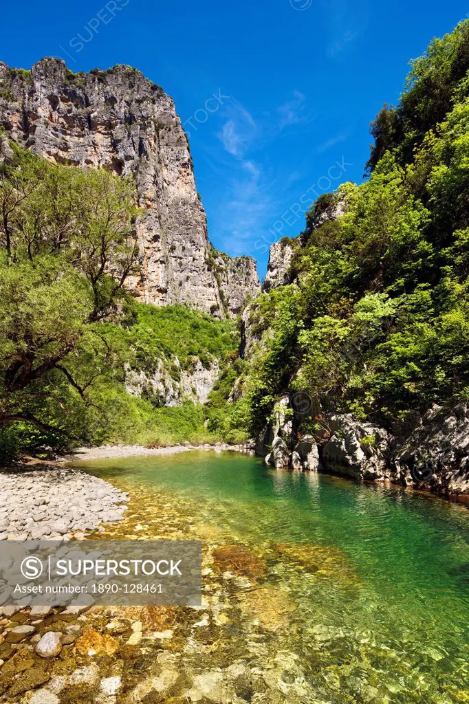 The clear waters of the Voidomatis River in the Vikos Gorge in spring, Zagoria, Epirus, Greece, Europe