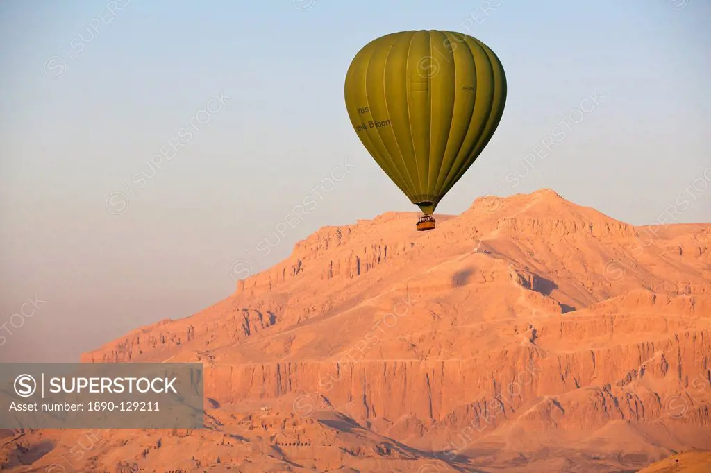 Hot air balloon suspended over the Theban hills of Luxor, Thebes, Egypt, North Africa, Africa