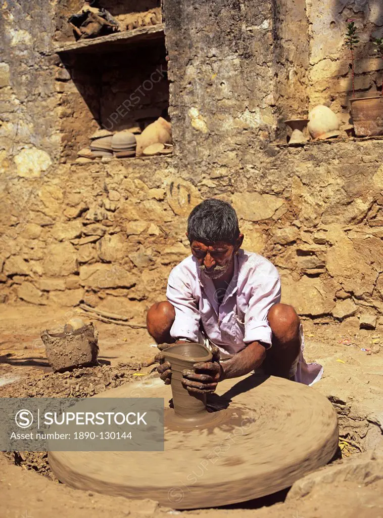The village potter at work making water pots in Nimaj, Rajasthan, India, Asia