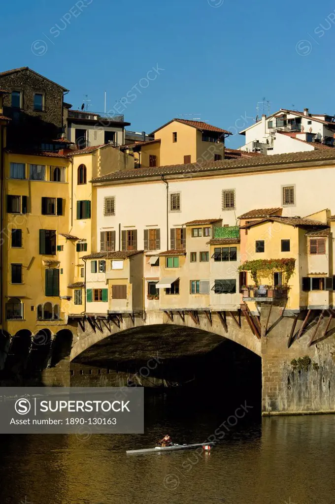 A rower headed under the Ponte Vecchio, Florence, UNESCO World Heritage Site, Tuscany, Italy, Europe