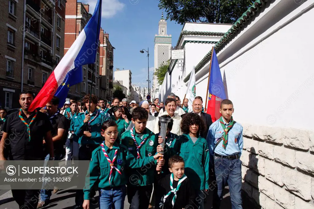 Muslim scouts carrying a torch outside the Paris Great Mosque, Paris, France, Europe