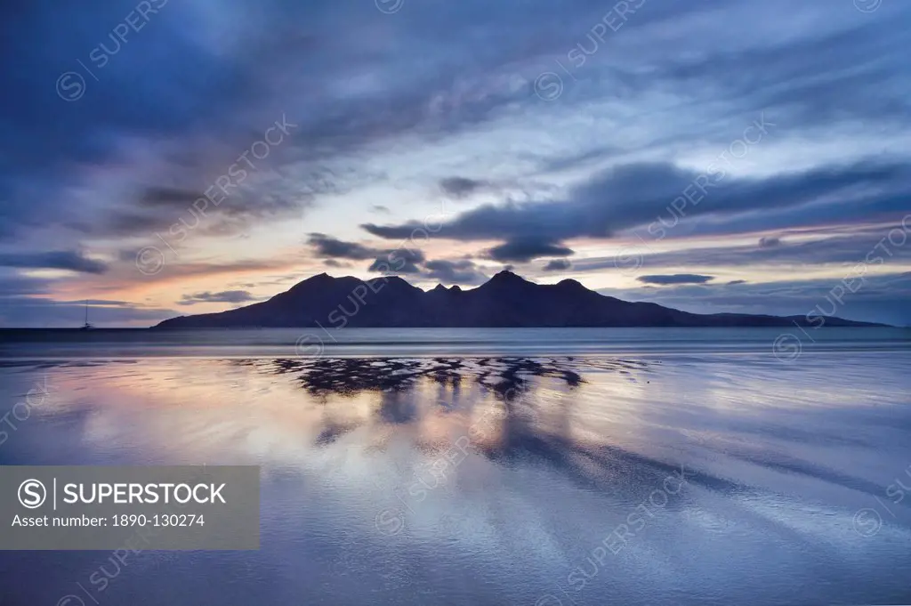 Dusk, looking to towards Rum from the Bay of Laig on Eigg, Inner Hebrides, Scotland, United Kingdom, Europe