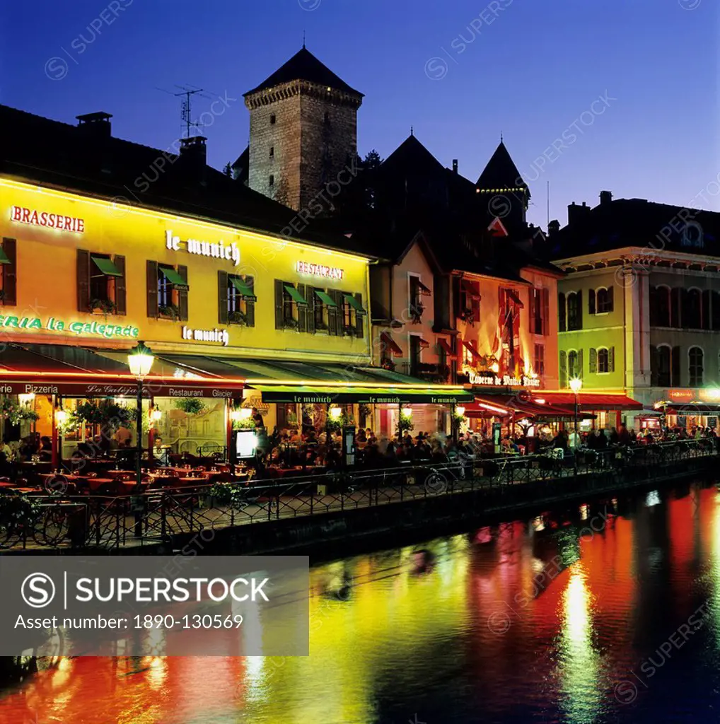 Canal side restaurants below the Chateau at dusk, Annecy, Lake Annecy, Rhone Alpes, France, Europe