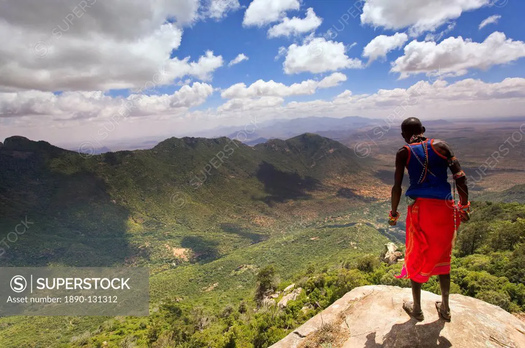Samburu man looks down over the Ewaso Rongai Valley from Mount Nyiru, Northern Frontier, Kenya, East Africa, Africa