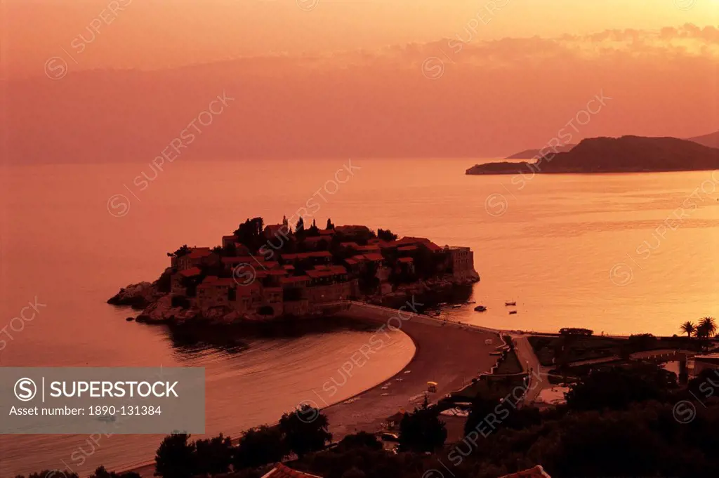 Sunset over island of Sveti Stefan, Sveti Stefan, The Budva Riviera, Montenegro, Europe