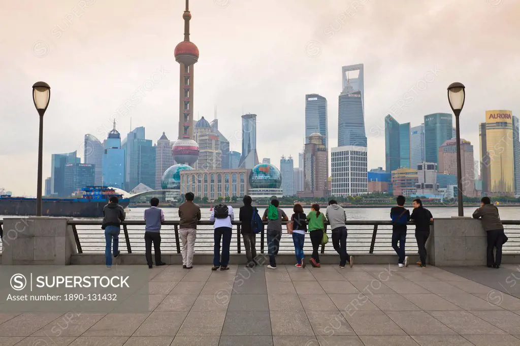 People viewing the Pudong skyline and the Oriental Pearl Tower from the Bund, Shanghai, China, Asia