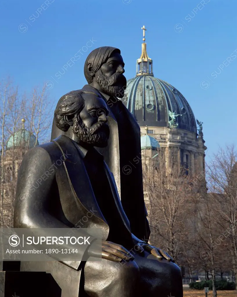 Statues of Marx and Engels, with the Dom cathedral, behind, Berlin, Germany, Europe