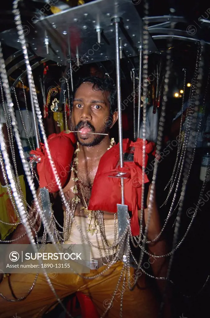 Man with pierced tongue at the annual Hindu festival of Thaipusam at the Batu Caves near Kuala Lumpur, Malaysia, Southeast Asia, Asia