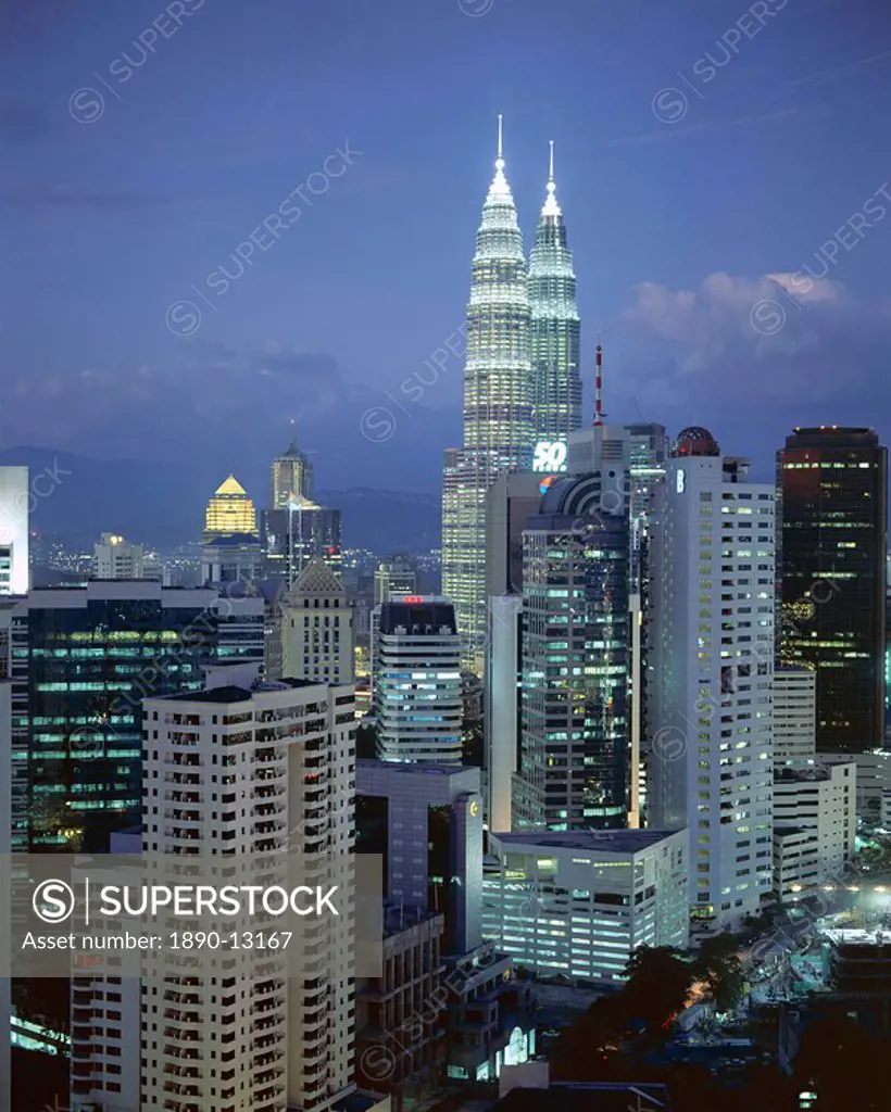 City skyline in the evening, with the twin towers of the Petronas Building, Kuala Lumpur, Malaysia, Asia