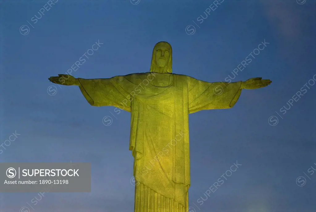 Floodlit statue of Christ the Redeemer at 710m on Mount Corcovado, above Rio de Janeiro, Brazil, South America
