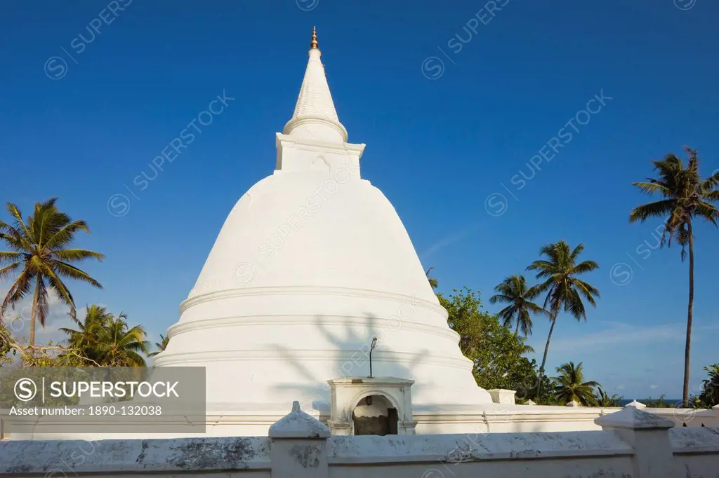 Stupa dagoba at a small Buddhist temple overlooking the south coast at Mirissa, near Matara, Southern Province, Sri Lanka, Asia