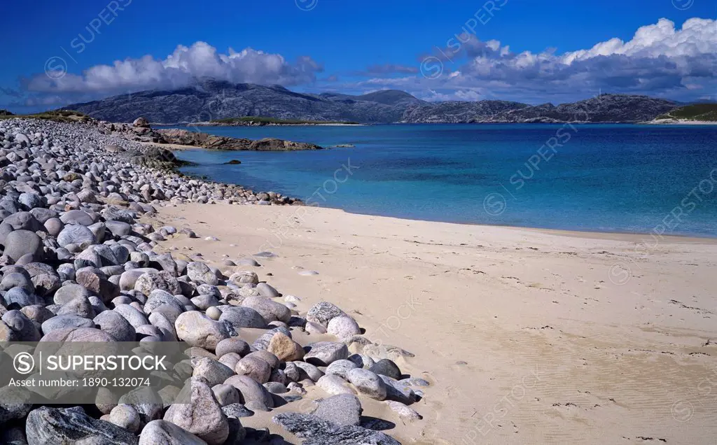 Sand and boulder beach on the island of Scarp just off the Isle of Harris on a late afternoon in June, Outer Hebrides, Scotland, United Kingdom, Europ...