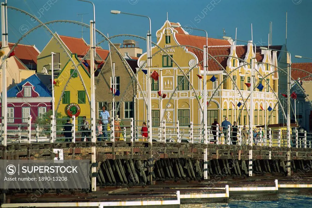 The Queen Emma Pontoon Bridge before the colonial gabled waterfront buildings of Willemstad, UNESCO World Heritage Site, Curacao, West Indies, Caribbe...