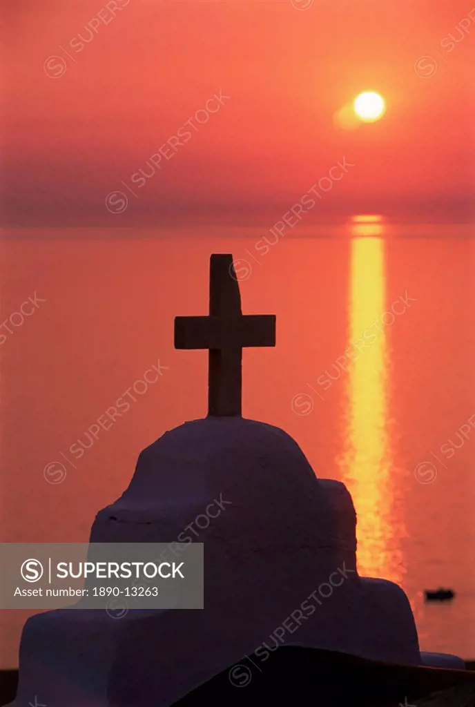 Church cross against the sunset, island of Mykonos, Hora, Cyclades, Greece, Europe