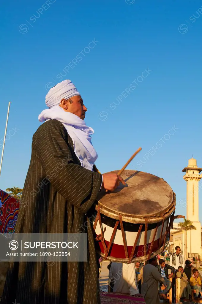 Drummer at Tahtib demonstration, a traditional form of Egyptian folk dance involving a wooden stick, also known as stick dance or cane dance, Mosque o...