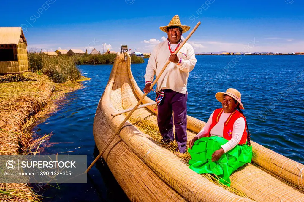 Quechua Indian couple on Floating Grass islands of Uros, Lake Titicaca, Peru, South America