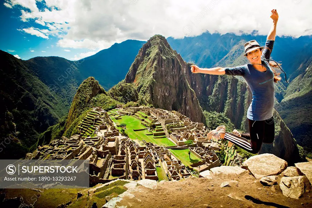 Laura Grier jumping at Machu Picchu ruins, Peru, South America