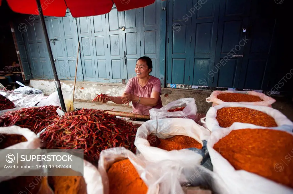 A woman selling spices on a market stall in Shan State, Myanmar (Burma), Asia