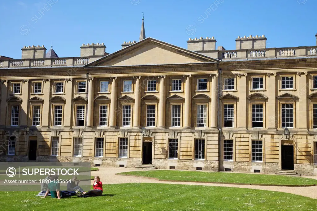 Students sitting outside in spring sunshine, Peckwater Quadrangle, designed by Henry Aldrich, Christ Church, Oxford University, Oxford, Oxfordshire, E...