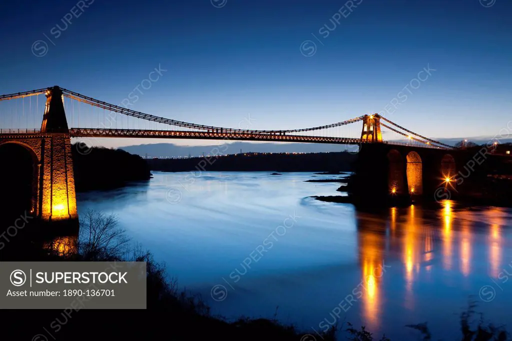 Evening illuminations on the Menai Bridge spanning the Menai Strait, Anglesey, North Wales, Wales, United Kingdom, Europe