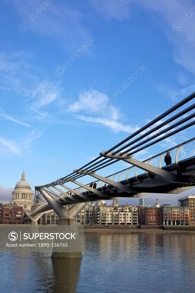 Pedestrians on Millennium Bridge, crossing the River Thames, taken from Bankside looking to St. Pauls Cathedral, London, England, United Kingdom, Euro...