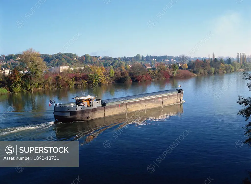 A barge on the River Seine at Bois le Roi, Ile de France, France, Europe