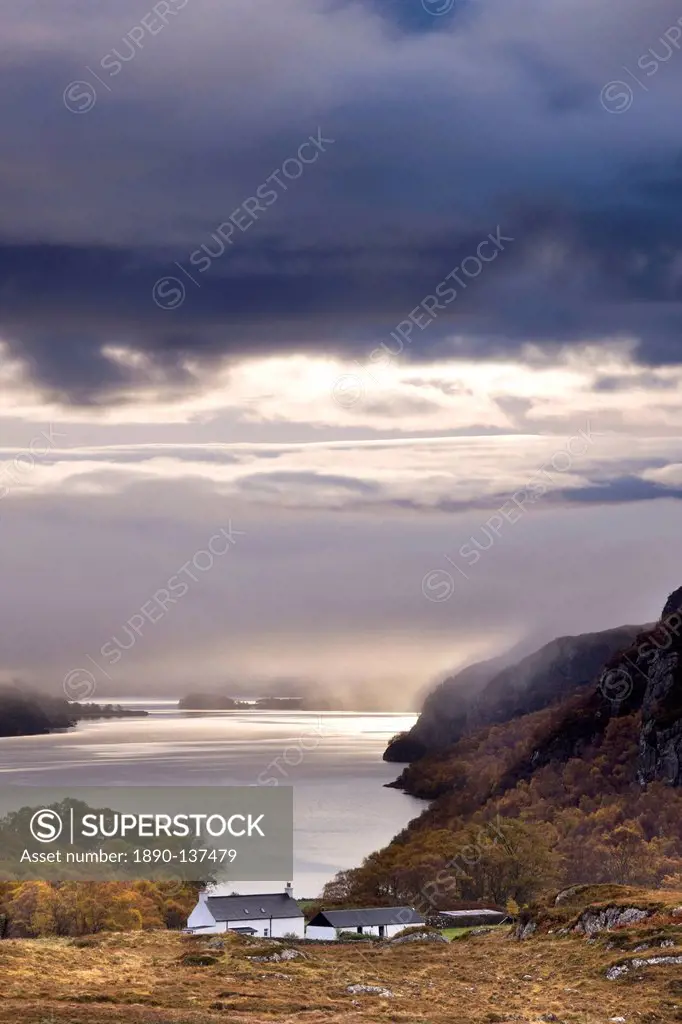 Early morning mist hanging over Loch Maree with Tollie Farm in foreground, near Poolewe, Achnasheen, Wester Ross, Highlands, Scotland, United Kingdom,...