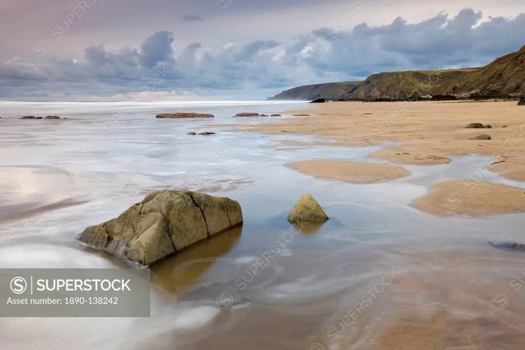 Incoming tide on Sandymouth Beach, Cornwall, England. United Kingdom, Europe
