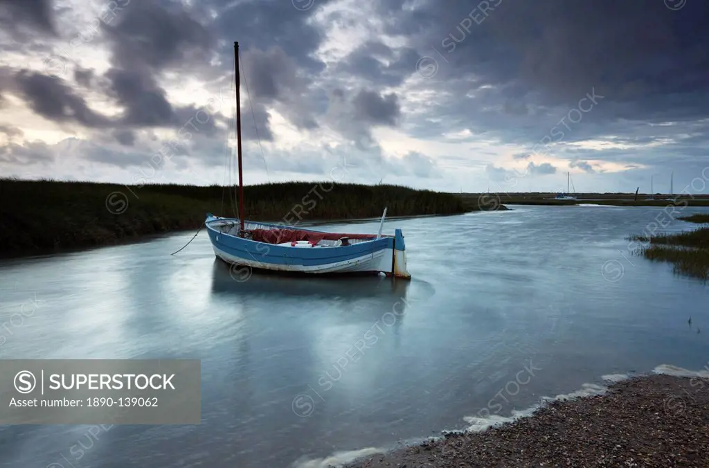 A moody and windy summer evening at Brancaster Staithe, North Norfolk, England, United Kingdom, Europe