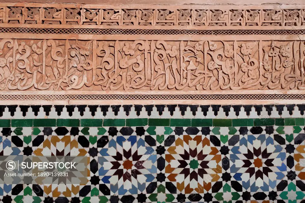 Calligraphy and zellige in the patio of the Medersa Ben Yousef, built in 1570, the biggest Koranic school in the Maghreb, Marrakesh, Morocco, North Af...