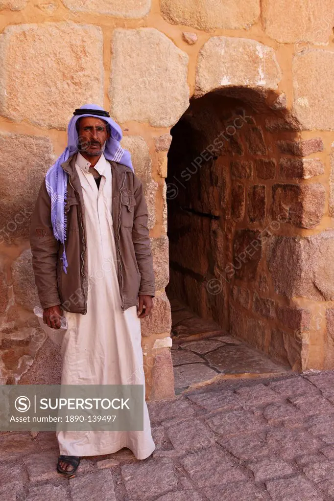 The gate keeper stands by the single entrance to the UNESCO World Heritage Site of St. Catherine´s Monastery, Sinai Peninsula, Egypt, North Africa, Af...