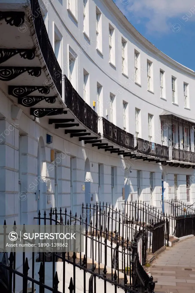 Terrace of Regency style Georgian houses with wrought iron balconies on The Royal Crescent, Cheltenham Spa, Gloucestershire, England, United Kingdom, ...