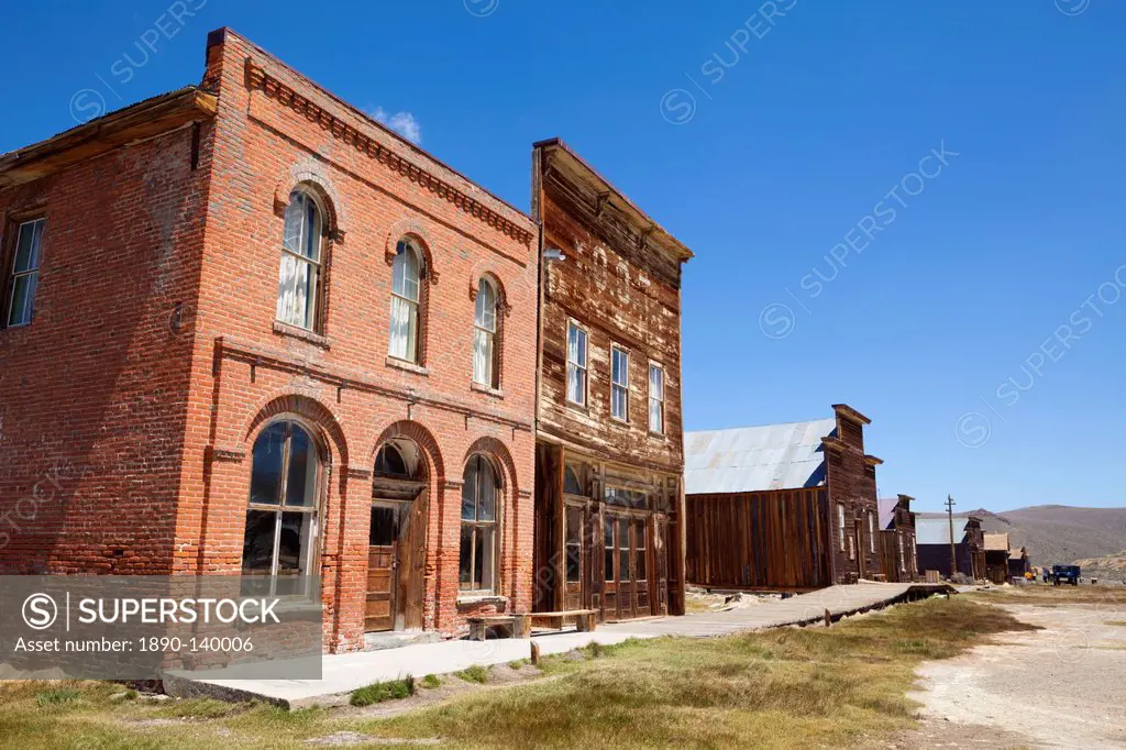 Brick Post Office and Dechambeau hotel, next to the wooden IOOF or Bodie Odd Fellows Lodge, a masonic lodge dating from 1878, on Main Street in the go...
