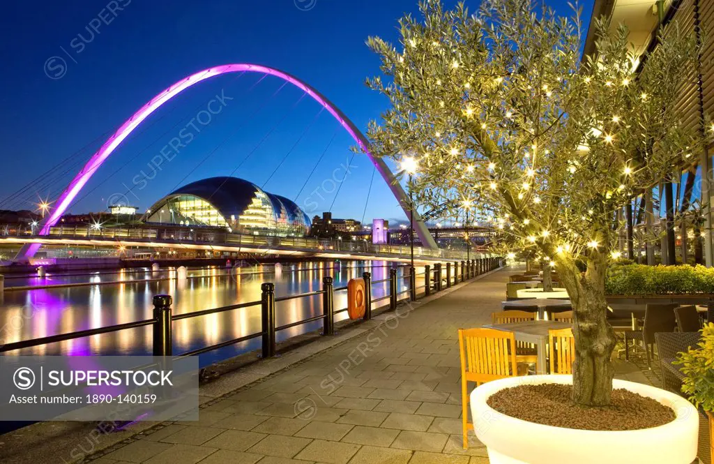 View along Newcastle Quayside at night showing the River Tyne, the floodlit Gateshead Millennium Bridge and the Sage Gateshead, Newcastle_upon_Tyne, T...
