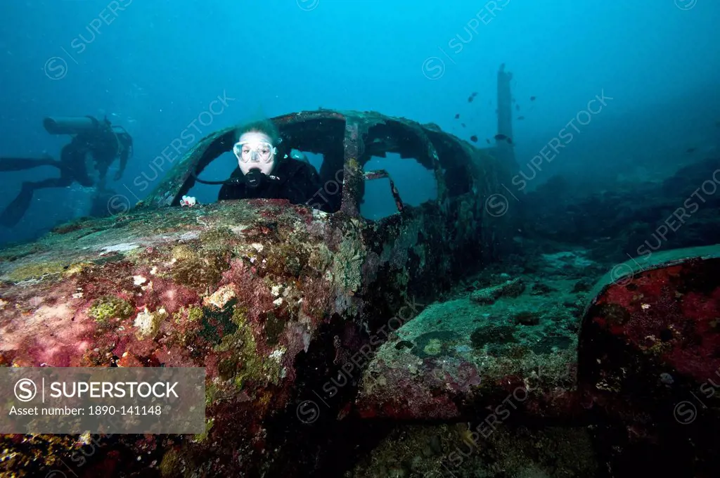 Diver inside the wreck of a four seater airplane, Philippines, Southeast Asia, Asia