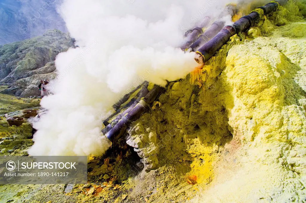Toxic sulphur fumes escaping from the ceramic pipes at Kawah Ijen, Java, Indonesia, Southeast Asia, Asia