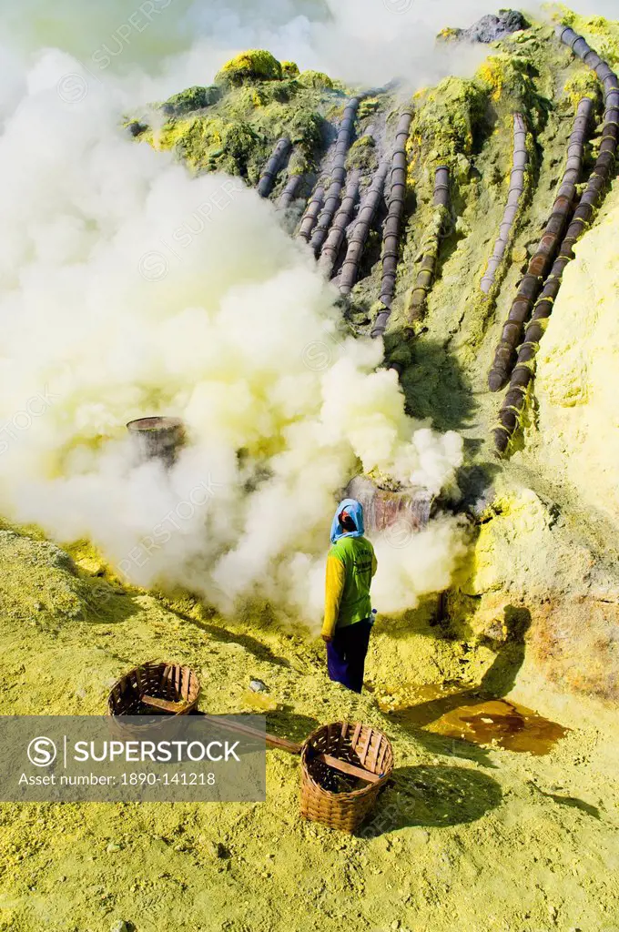 Sulphur worker mining sulphur at the bottom of the crater, Kawah Ijen, Java, Indonesia, Southeast Asia, Asia