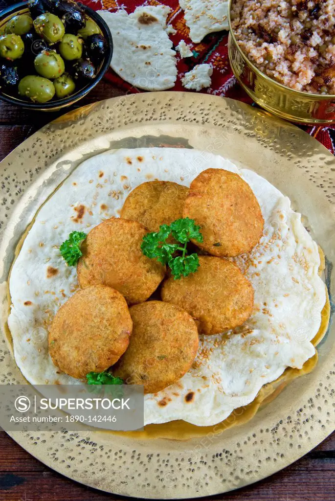Falafel, a deep_fried balls or patties made from ground chickpeas and or fava beans, Arabic Countries