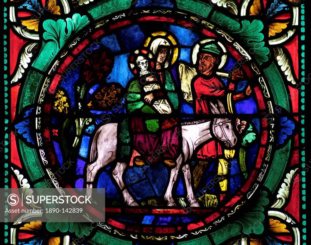 Medieval stained glass depicting Mary, baby Jesus and Joseph on a donkey, Canterbury Cathedral, UNESCO World Heritage Site, Canterbury, Kent, England,...