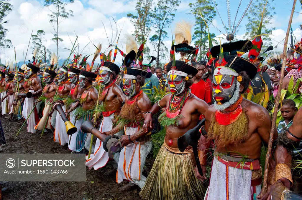 Colourfully dressed and face painted local tribes celebrating the traditional Sing Sing in the Highlands of Papua New Guinea, Pacific