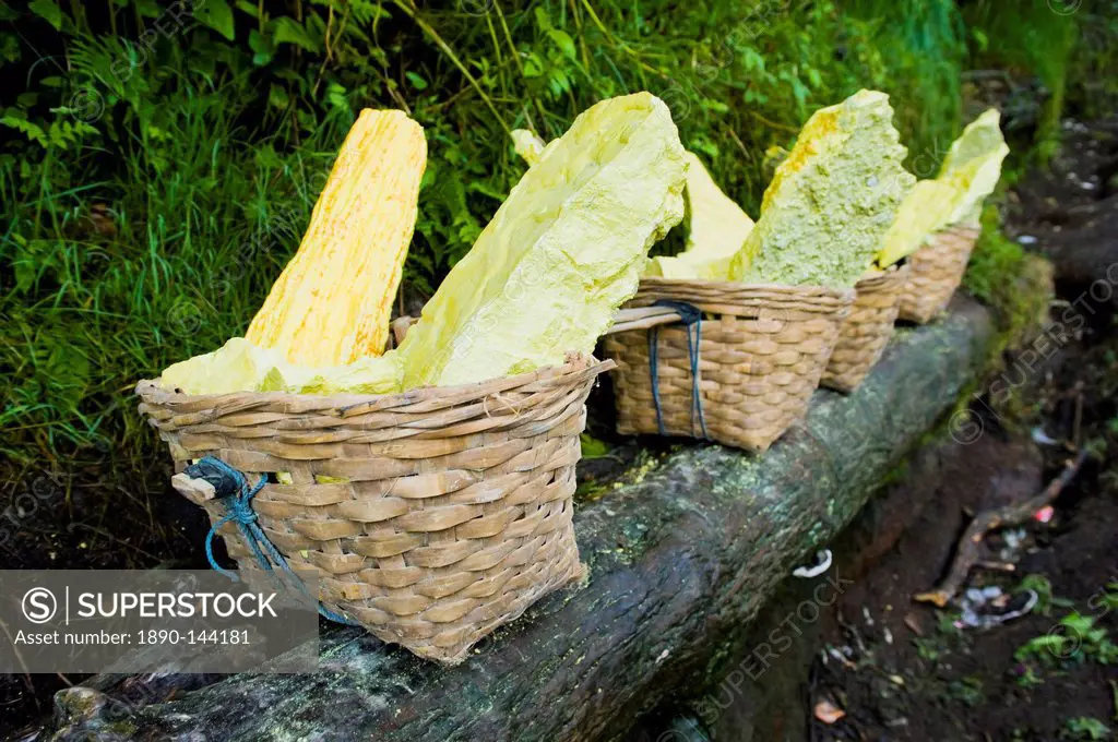 Baskets of bright yellow sulphur, Kawah Ijen, Java, Indonesia, Southeast Asia, Asia